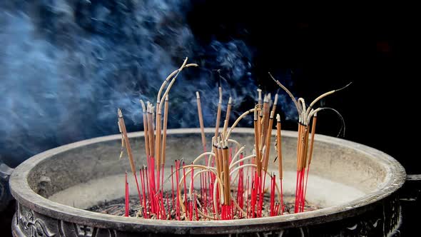 Incense Sticks Burning In Giant Pot In Front Of Buddhist Temple 3