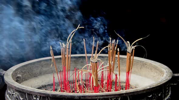 Incense Sticks Burning In Giant Pot In Front Of Buddhist Temple 4