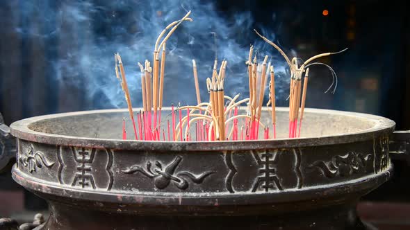 Incense Sticks Burning In Giant Pot In Front Of Buddhist Temple 5