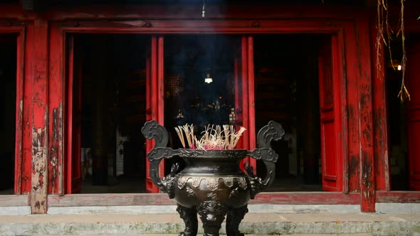 Incense Sticks Burning In Giant Pot In Front Of Buddhist Temple 6