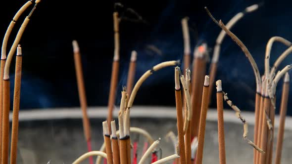 Close Up Of Incense Sticks Burning In Giant Pot In Front Of Buddhist Temple 2