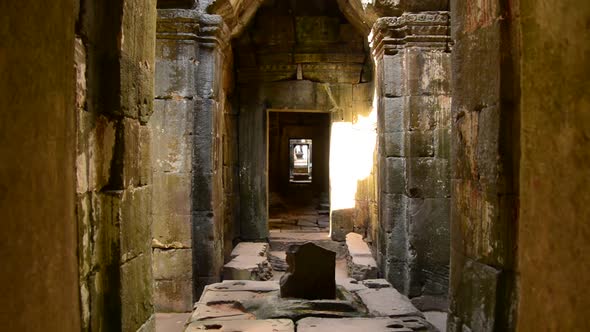Zoom Out Of Temple Hallway With Sunlight Shining In  - Angkor Wat Temple Cambodia