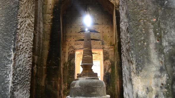 Zoom Out Of Temple Spire With Sunlight Forming A Flame  - Angkor Wat Temple Cambodia