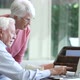Senior Couple Using Laptop On Desk At Home - VideoHive Item for Sale