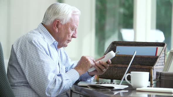 Senior Man Finding Phone Number Of Company Online 1 alt