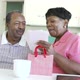 Senior Man Giving Wife Birthday Gift And Card 1 - VideoHive Item for Sale
