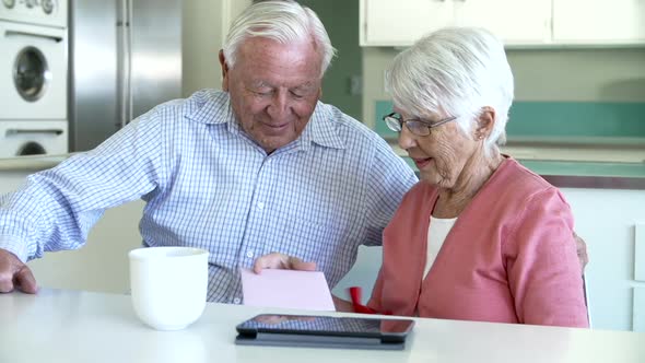 Senior Man Giving Wife Birthday Gift And Card 2 alt