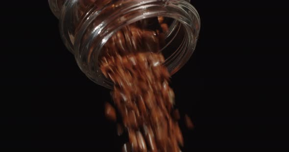 Flax Seeds Pour From Jars On The Table