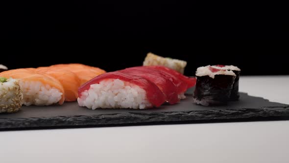 Sushi assortment rotating on a plate alt