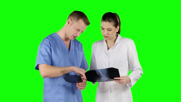 Two Doctors with X-ray Prints. Green Screen alt