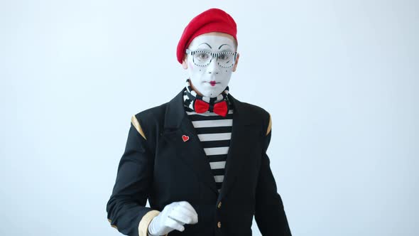 Slow Motion Portrait of Pantomimist Showing Hush Hand Gesture Asking To Keep Secret alt