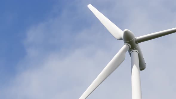 Wind turbine spinning to generate electricity for households