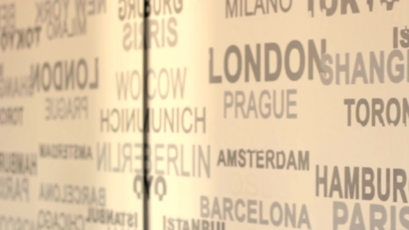 The Names Of Major Cities Sweep In Front Of Camera