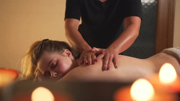 A Client Enjoys a Back Massage at the Massage Spa