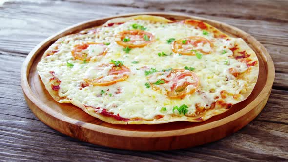 Baked pizza with cherry tomato toppings alt