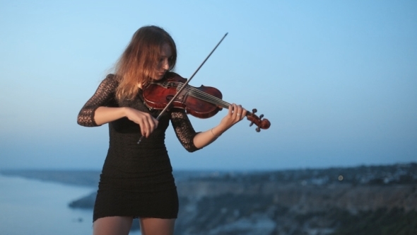 Concentrated Young Violinist Playing While