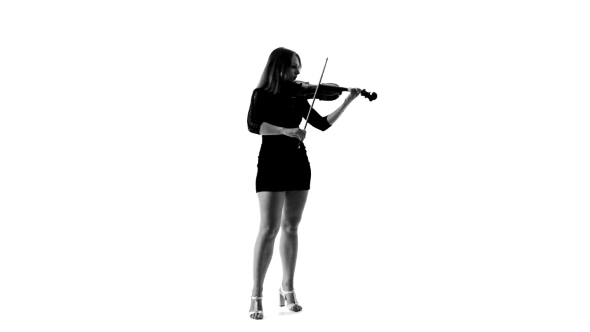 Silhouette Of Girl In a Short Black Dress Playing
