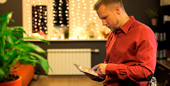 Man with the Tablet in a Beautiful Interior