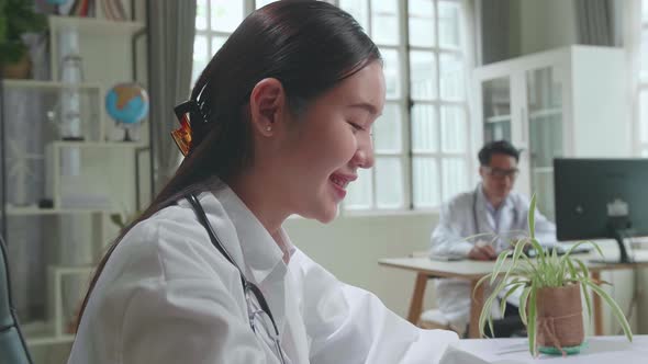 Close Up Young Asian Woman Doctor Is Using Laptop In Workplace. Medical Concept alt