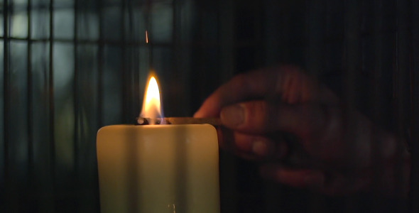 Lighting a Candle With Match
