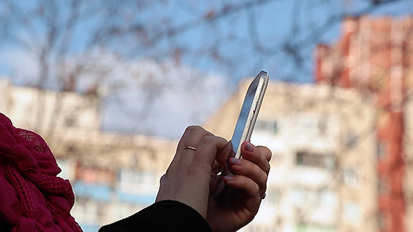 Girl Typing On A Mobile Phone alt