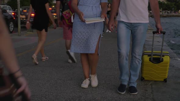 Man and Woman Travelers Searching Way with Touch Pad alt