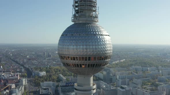 AERIAL: Super Close Up View of the Alexanderplatz TV Tower in Berlin, Germany on Hot Summer Day  alt