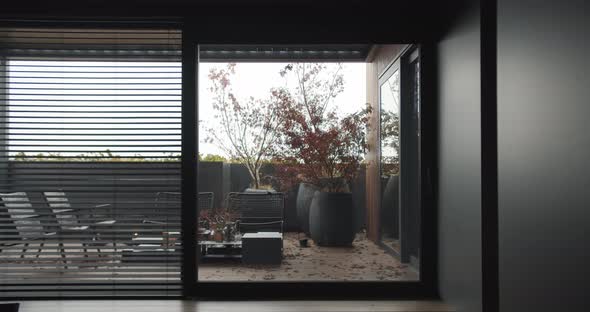 Minimalist Black Apartment with Style Terrace Japanese Trees and Wooden Floor alt