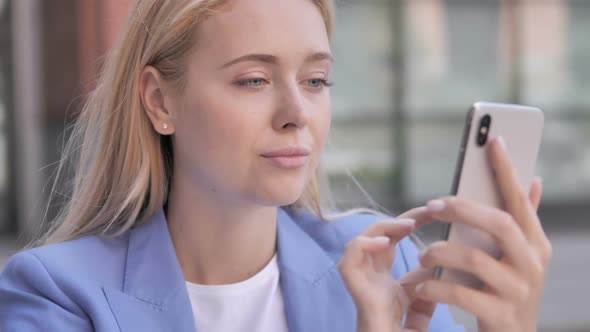 Young Businesswoman Using Smartphone alt