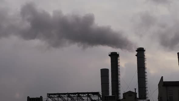Factory Smokestack Emitting Smoke Against Sky  Environmental Pollution