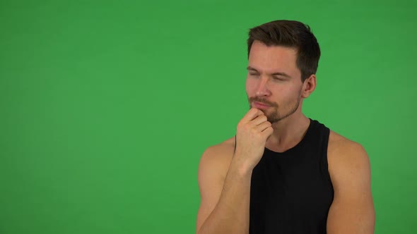 A Young Handsome Athlete Thinks About Something - Green Screen Studio alt