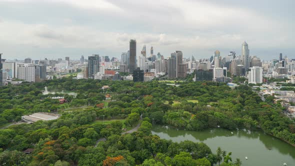Time lapse of aerial view of green trees in Lumpini Park, Sathorn district, Bangkok