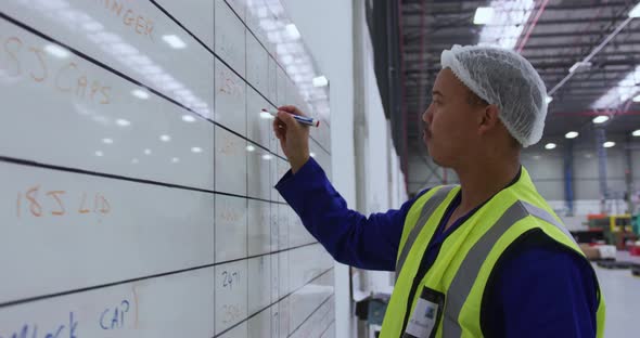 Young man working in a warehouse alt