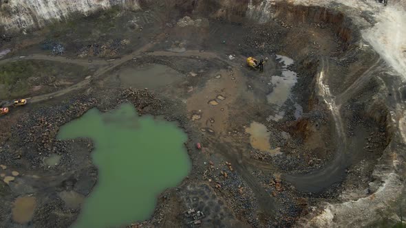 Aerial view basalt quarry of open pit with Bulldozer And Car alt