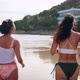 Slow Motion of Happy Beautiful 2 Women in Bikini Running Towards the Sea on the Beach - VideoHive Item for Sale