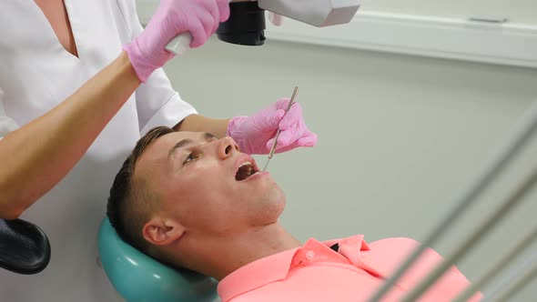 Modern Dental Clinic with Microscope Tool for Treatment Patients alt