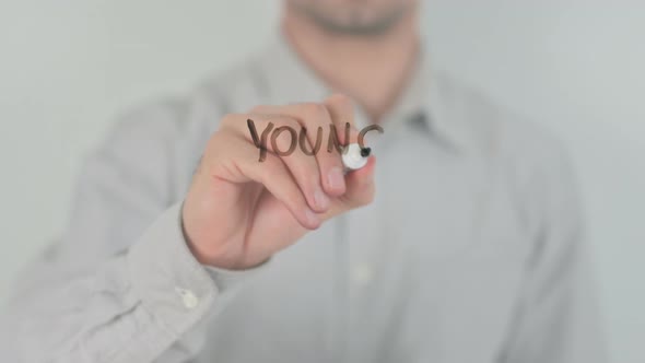Young Entrepreneur Writing on Screen with Hand alt
