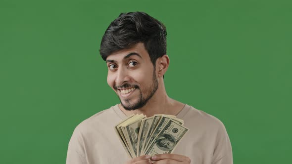 Happy Arabian Man Successful Smiling Hispanic Indian Businessman Isolated in Green Studio Looking at alt