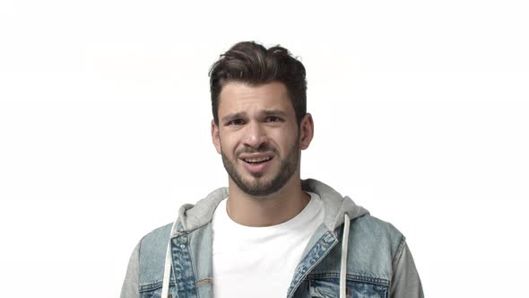 Slowmotion Embarrassed and Indesicive Handsome Bearded Guy Feeling Unsure or Skeptical Frowning alt