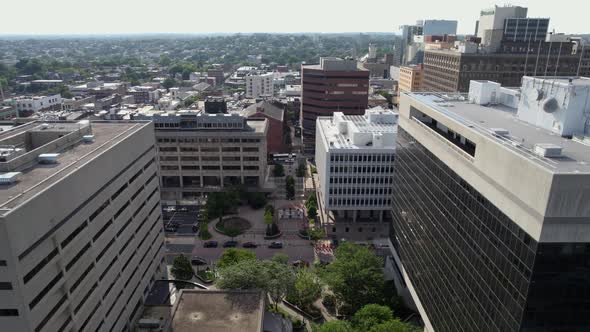 Aerial view in middle of buildings in the city centre of Wilmington, Delaware, USA - pull back, dron alt