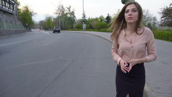 Pretty Business Woman Walking on the Road and Hitching Automobile, Problem alt
