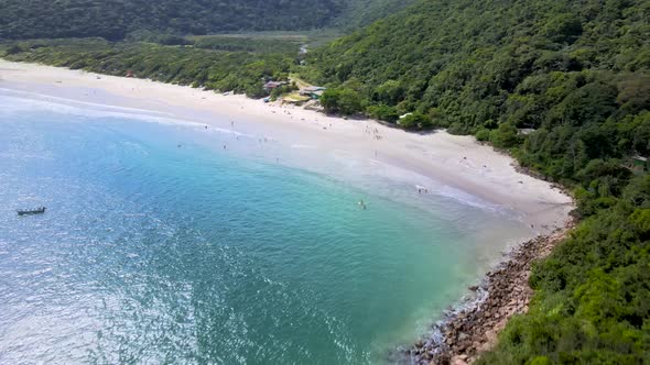 Aerial drone view of tropical deserted paradise beach with rocky coast and atlantic forest turquoise alt