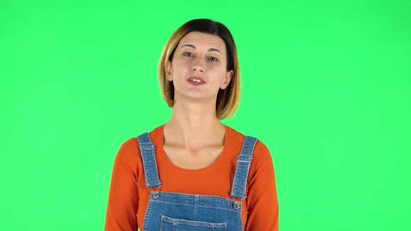 Beautiful Girl Is Reporting and Tells a Lot of Interesting Informations. Green Screen alt