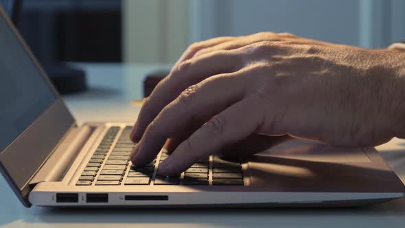 Hands Typing on Laptop Computer