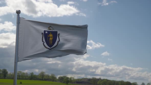 Flag of Massachusetts State Region of the United States Waving at Wind alt