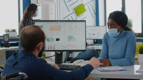 Multiethnic Colleagues with Masks Working in New Normal Startup Company alt