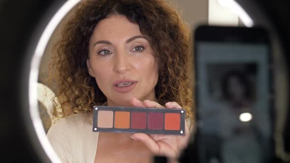 Beautiful Middleaged Woman Beauty Blogger Talks About Eye Shadows and Eye Makeup