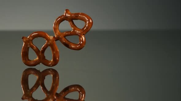 Pretzels falling and bouncing in ultra slow mo  alt