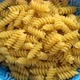 Fusilli pasta on blue background - VideoHive Item for Sale