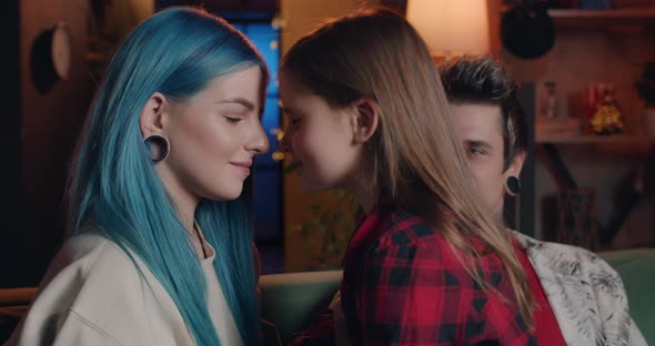 Young Modern Familly Smiling and Having Fun at Sofa in Living room.Modern Millennial Mom and Her alt